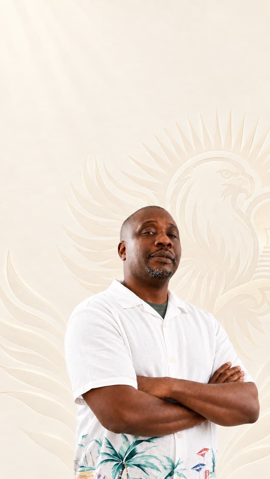 Tyshaun Perryman, founder of Insightful Recovery Solutions, arms crossed in front of the IRS eagle emblem